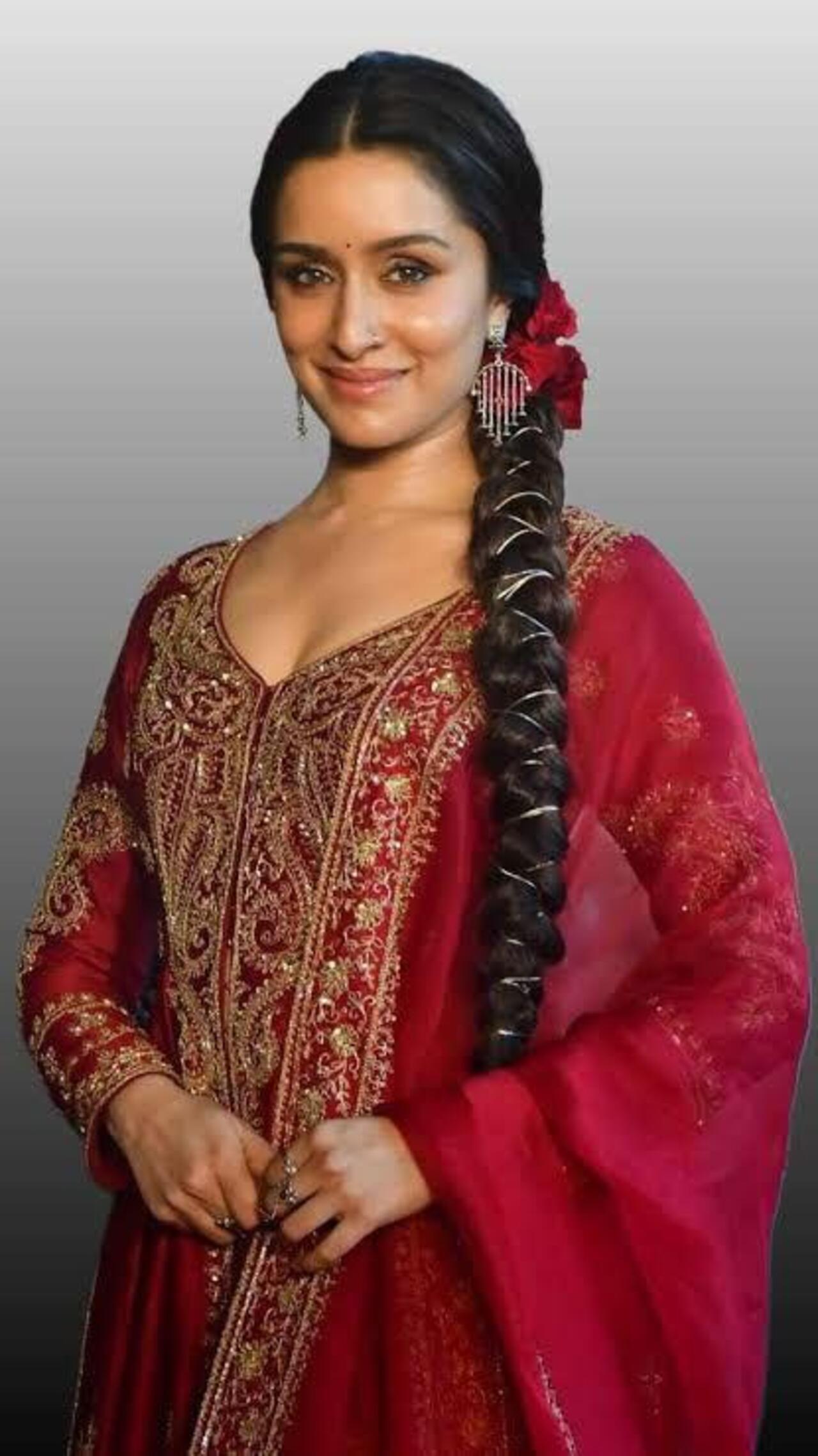 Shraddha Kapoor shows how to level up your hairstyle game with a thick braid and zest it up with a golden thread around the pleats. 